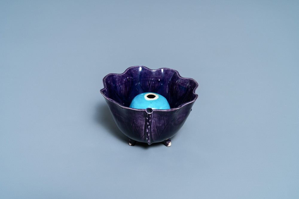 A Chinese aubergine- and turquoise-glazed 'lotus' trick cup, Kangxi